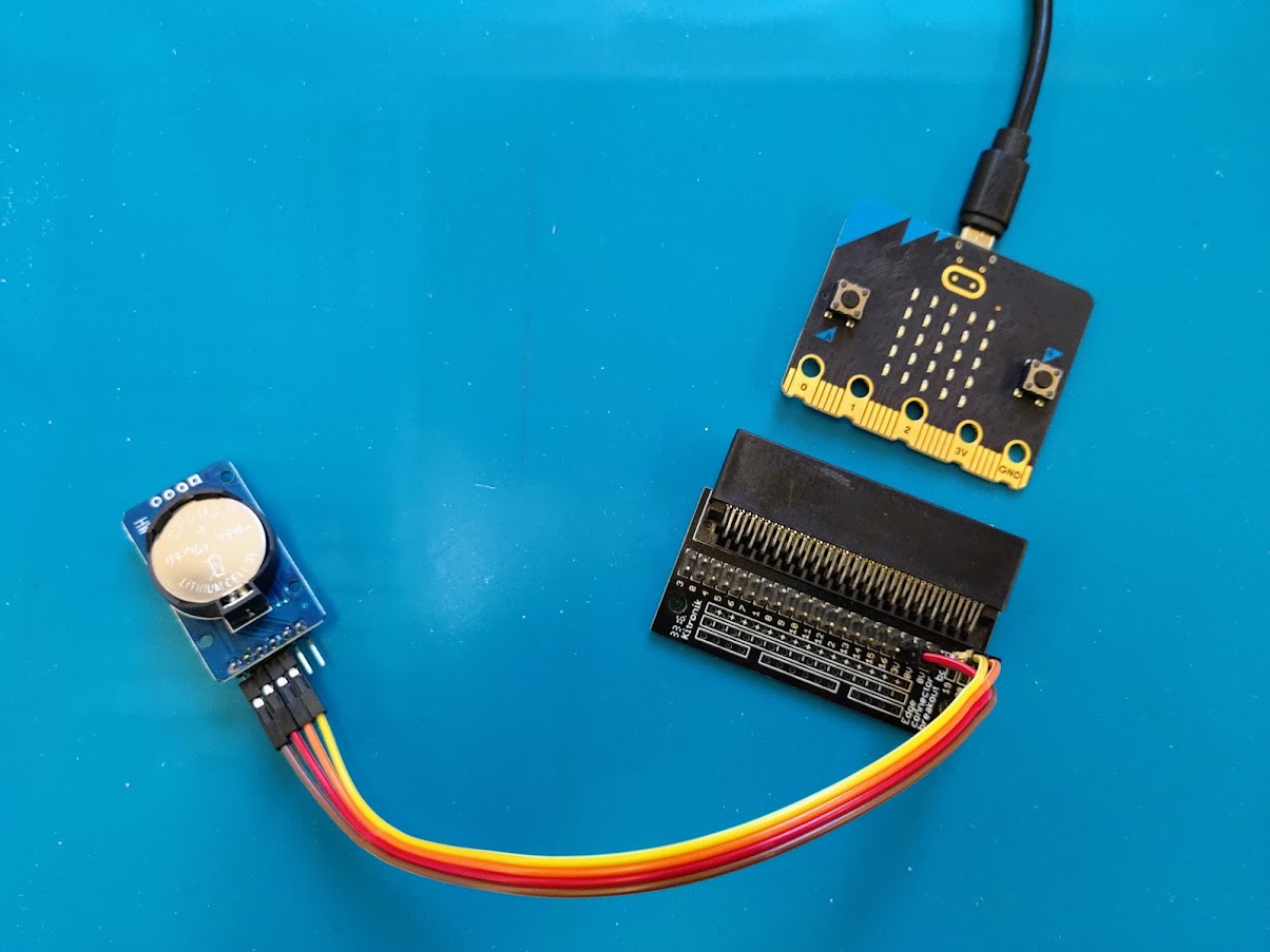 micro:bit next to edge connector with RTC module connected with jumper leads